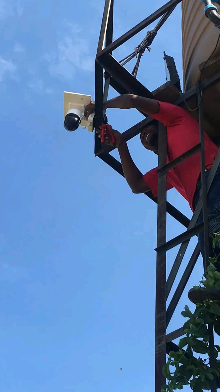 Sharp Edge technician installing an HD CCTV camera in Zambia